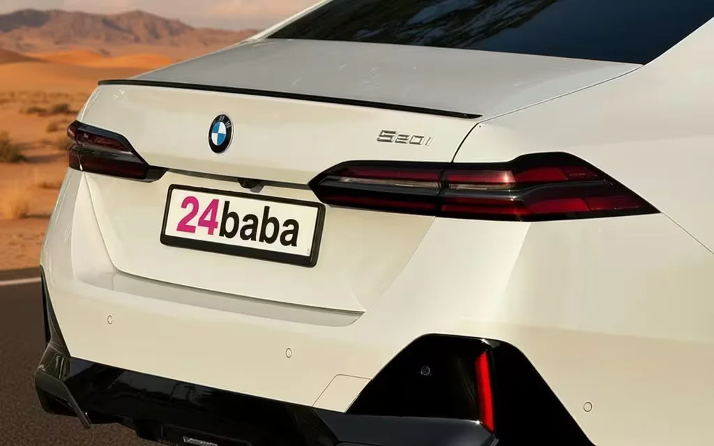 Bmw 520 2024 White rear view showing taillights – rental in Dubai
