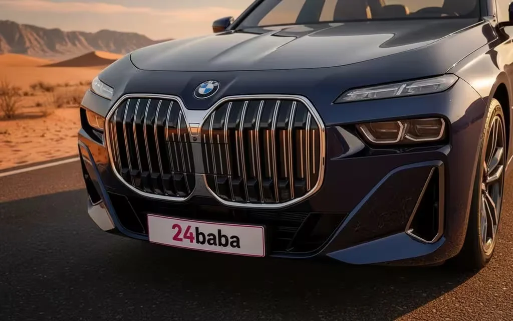Bmw 735 2023 blue front view with headlights – rental in Dubai