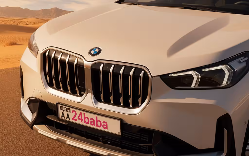 Bmw X1 2024 White front view with headlights – rental in Dubai