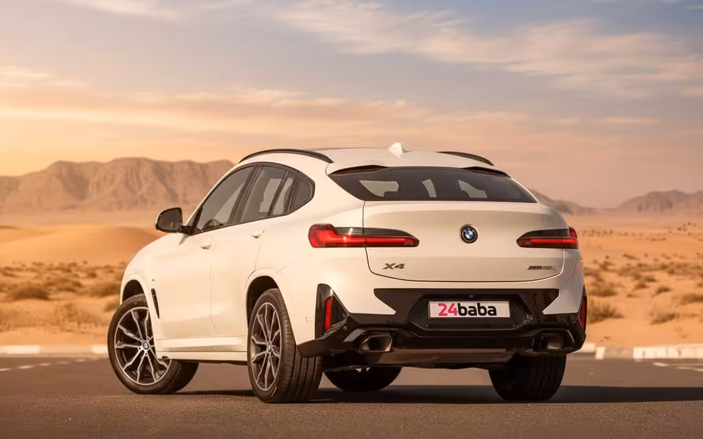 Bmw X4 2024 White rear view showing taillights – rental in Dubai