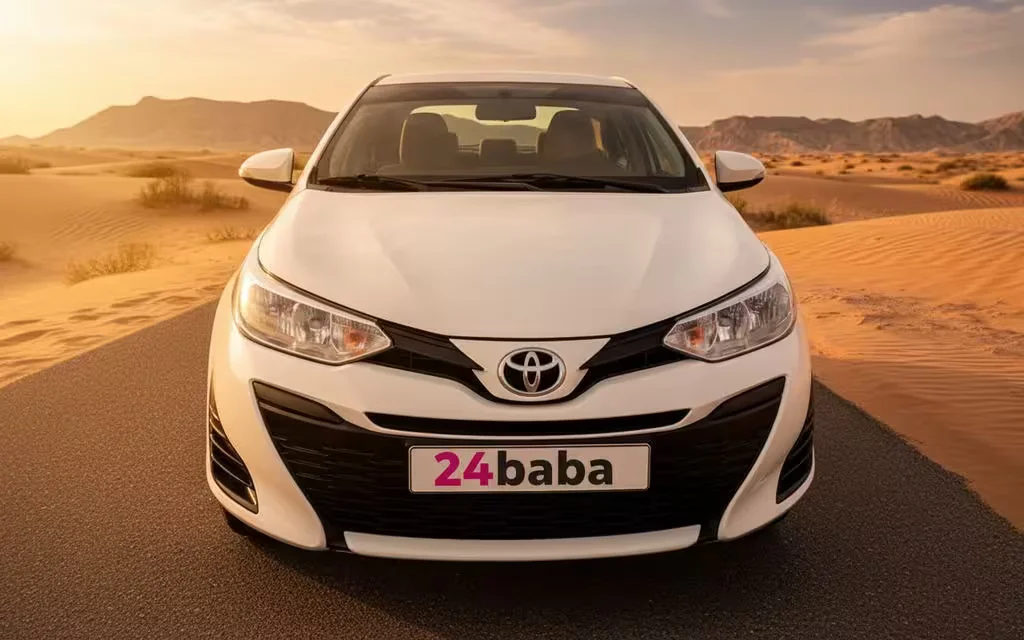 Toyota Yaris 2020 White front view with headlights – rental in Dubai