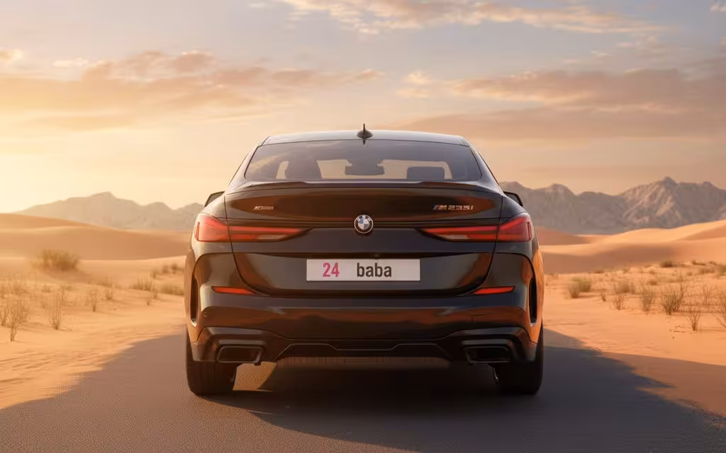 Bmw 235 2021 Black rear view showing taillights – rental in Dubai