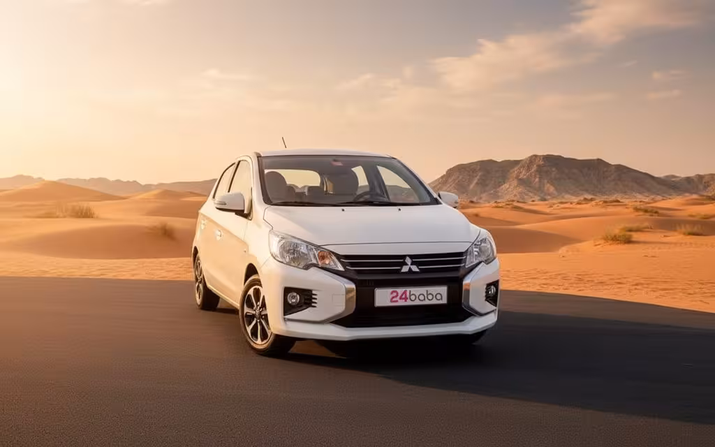 Mitsubishi Mirage 2023 White front view with headlights – rental in Dubai