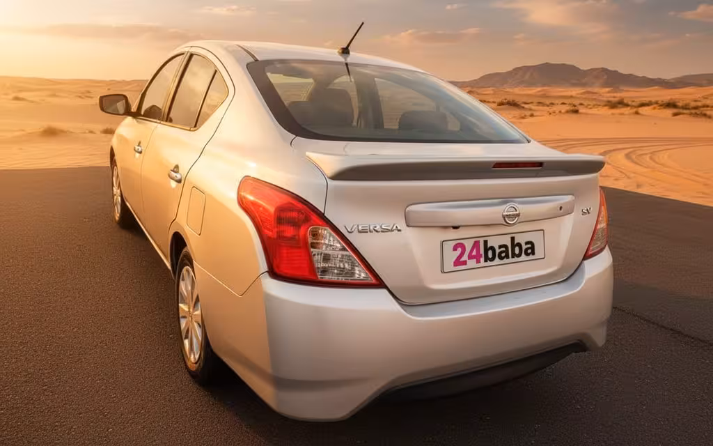 Nissan Versa 2025 Silver rear view showing taillights – rental in Dubai