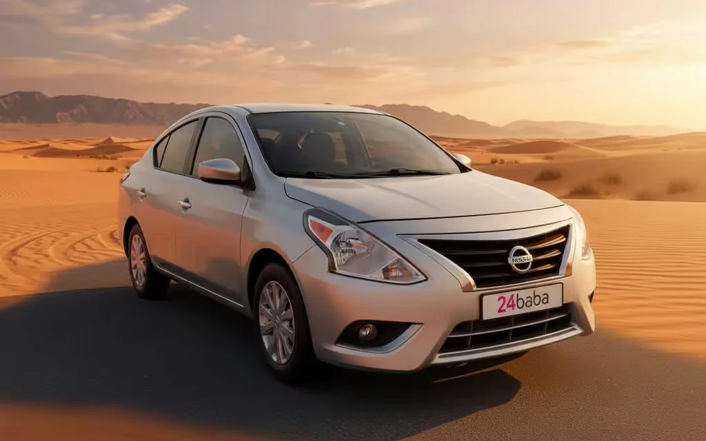 Nissan Versa 2025 Silver front view with headlights – rental in Dubai