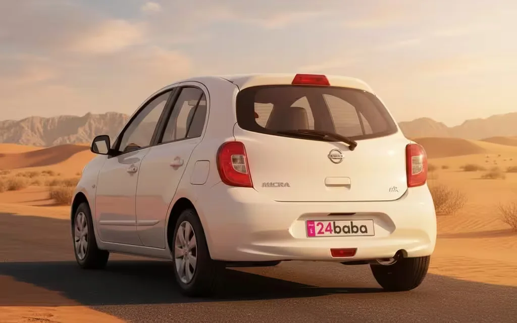 Nissan Micra 2025 White rear view showing taillights – rental in Dubai