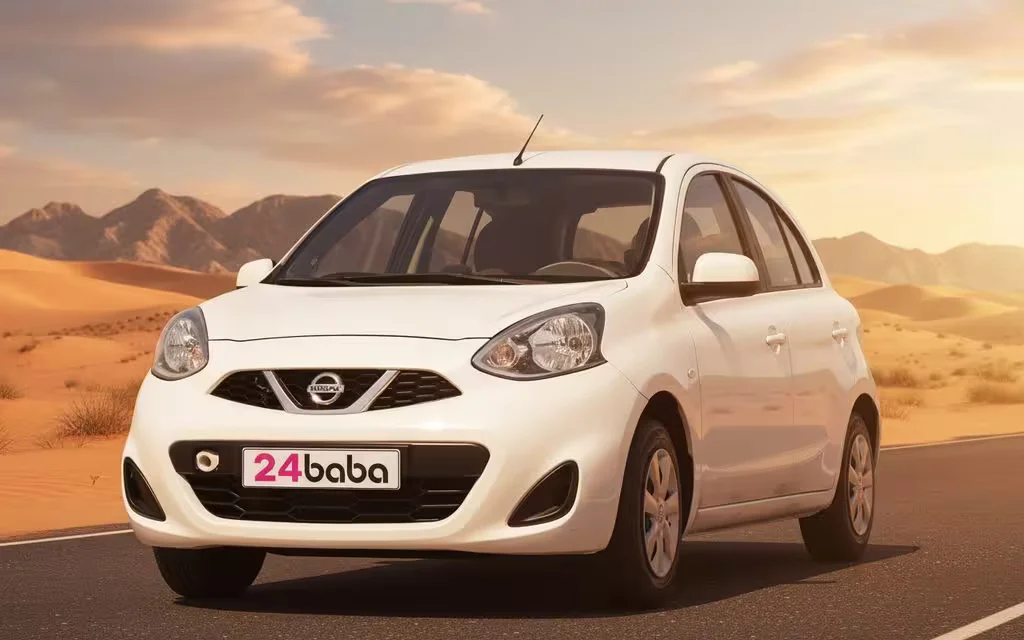 Nissan Micra 2025 White front view with headlights – rental in Dubai