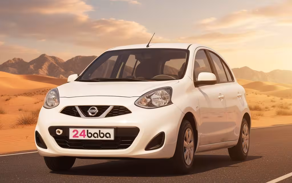 Nissan Micra 2025 White front view with headlights – rental in Dubai
