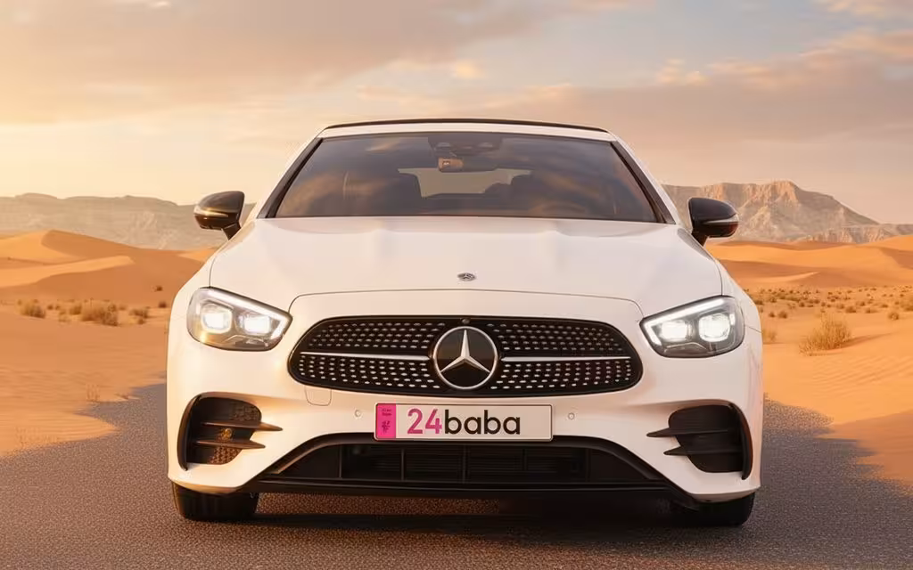 Mercedes E450 2022 White front view with headlights – rental in Dubai