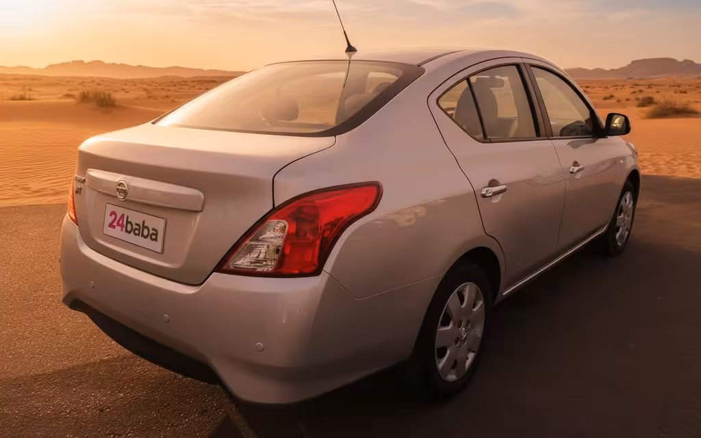 Nissan Sunny 2022 Grey rear view showing taillights – rental in Dubai
