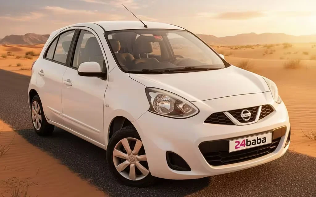 Nissan Micra 2020 White front view with headlights – rental in Dubai