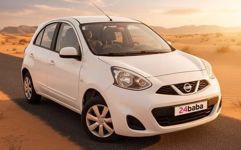 Nissan Micra 2020 White front view with headlights – rental in Dubai
