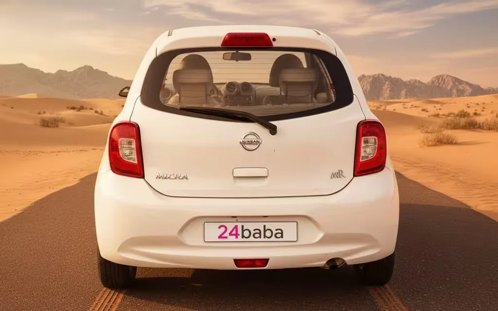 Nissan Micra 2020 White rear view showing taillights – rental in Dubai