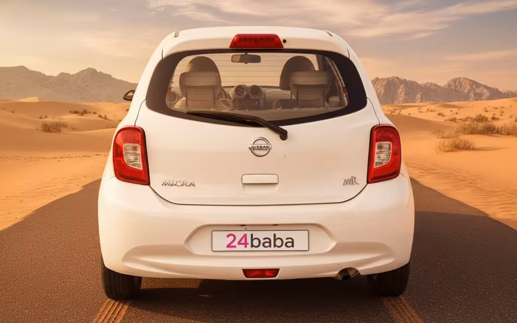 Nissan Micra 2020 White rear view showing taillights – rental in Dubai