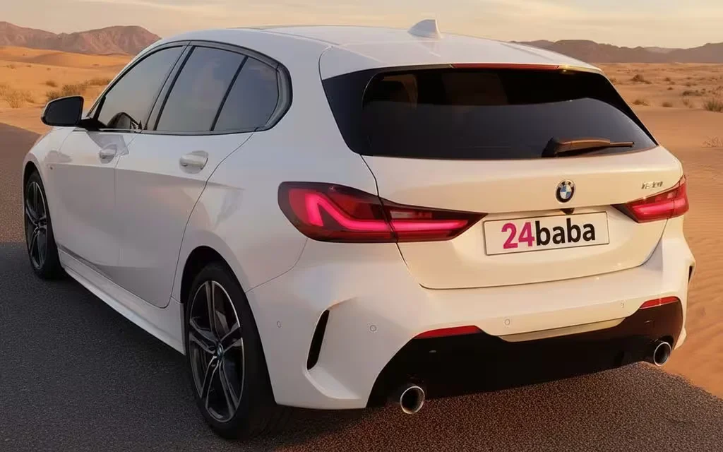 Bmw 120 2021 White rear view showing taillights – rental in Dubai