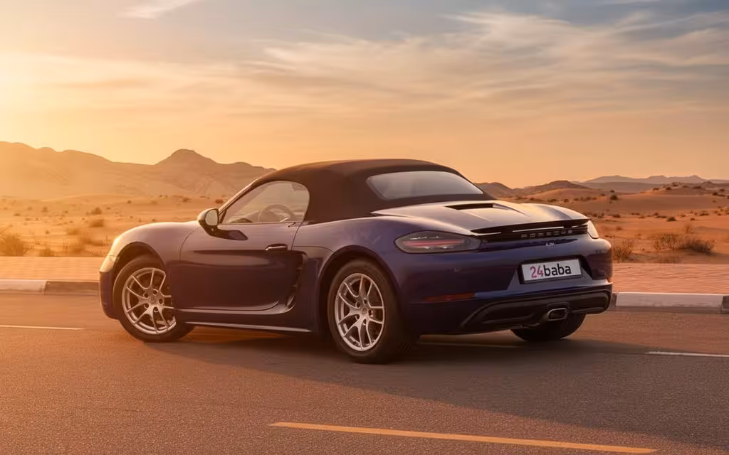 Porsche Boxster 2024 Black rear view showing taillights
