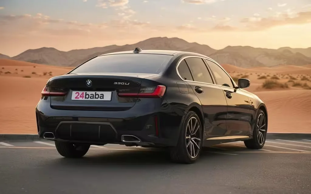 Bmw 330 2023 Black rear view showing taillights – rental in Dubai