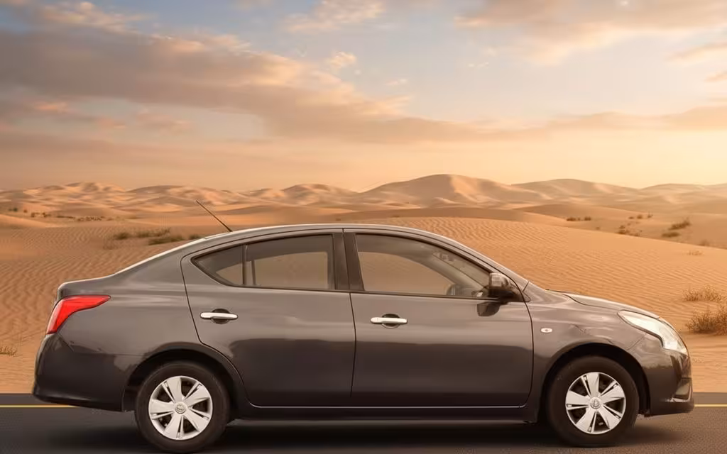 Nissan Sunny 2023 Grey side profile – rental in Dubai