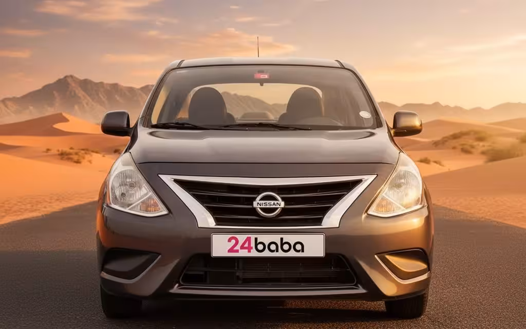 Nissan Sunny 2023 Grey front view with headlights – rental in Dubai