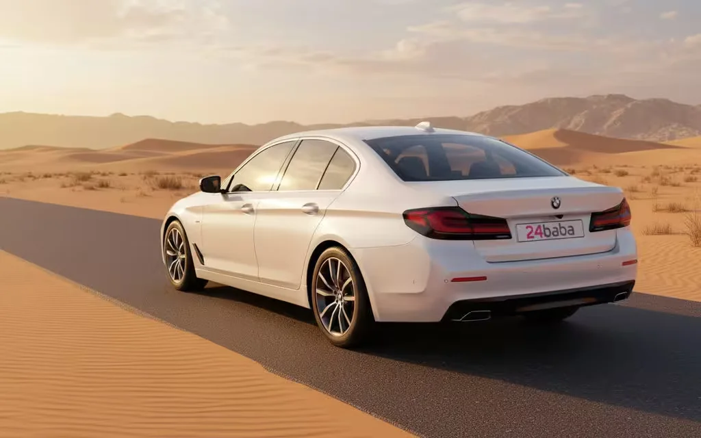 Bmw 520 2021 White rear view showing taillights – rental in Dubai