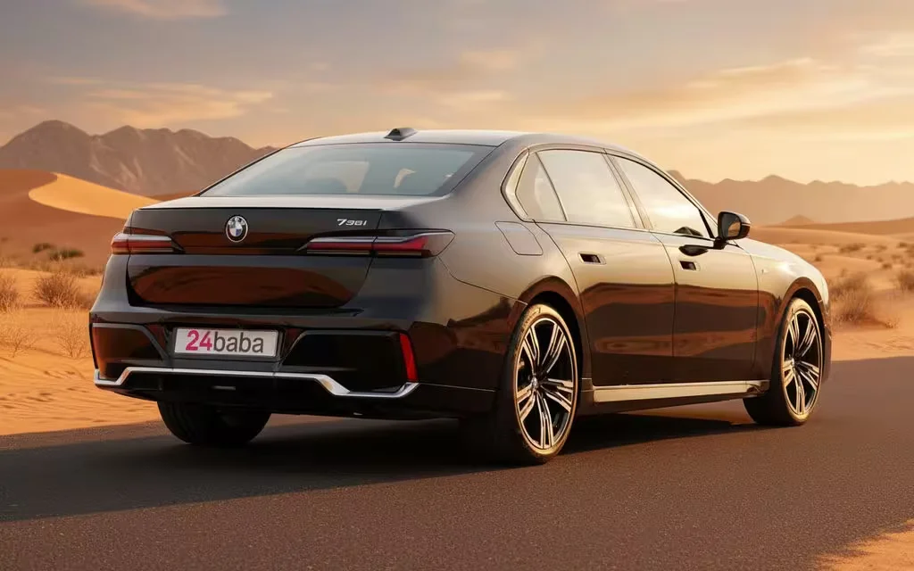 Bmw 735 2024 Black rear view showing taillights – rental in Dubai