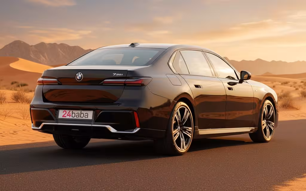 Bmw 735 2024 Black rear view showing taillights – rental in Dubai