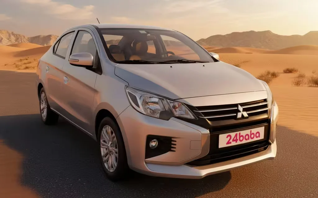 Mitsubishi Attrage 2024 Silver front view with headlights – rental in Dubai