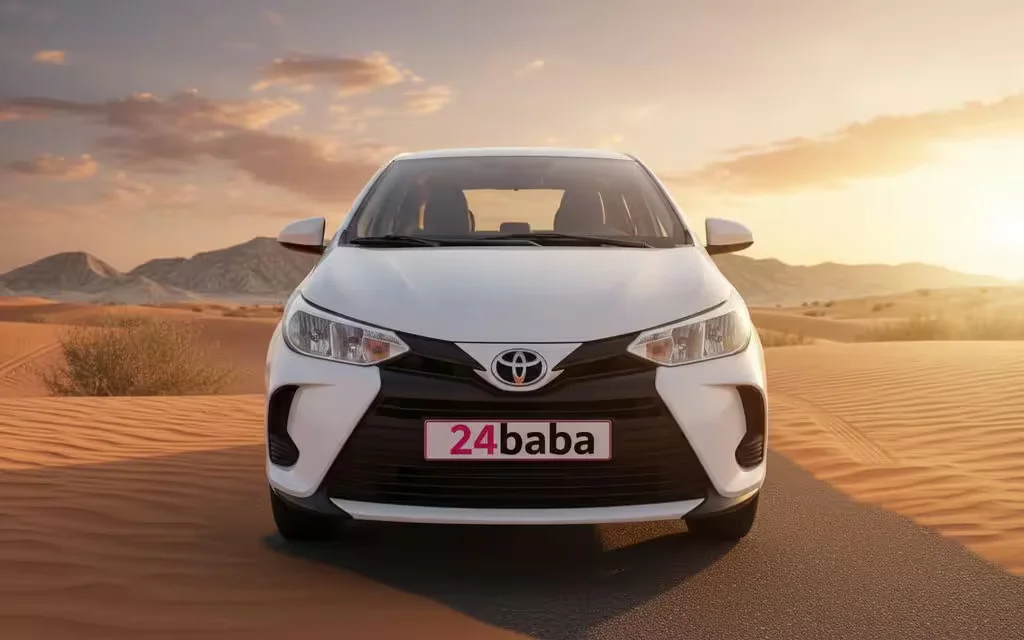 Toyota Yaris 2021 White front view with headlights – rental in Dubai