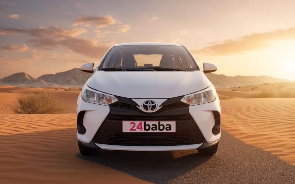 Toyota Yaris 2021 White front view with headlights – rental in Dubai