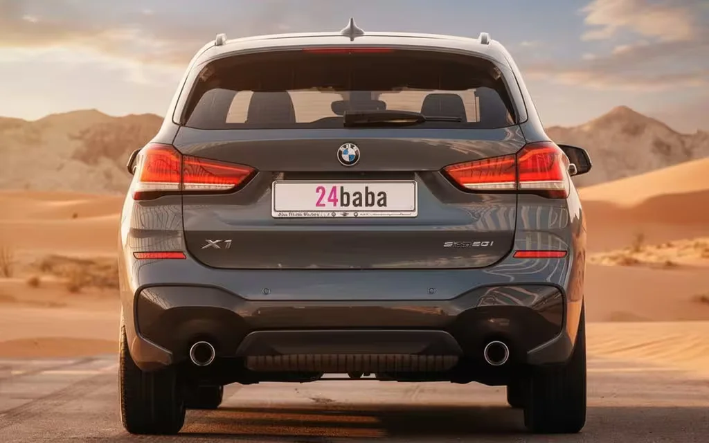 Bmw X1 2021 Blue rear view showing taillights – rental in Dubai