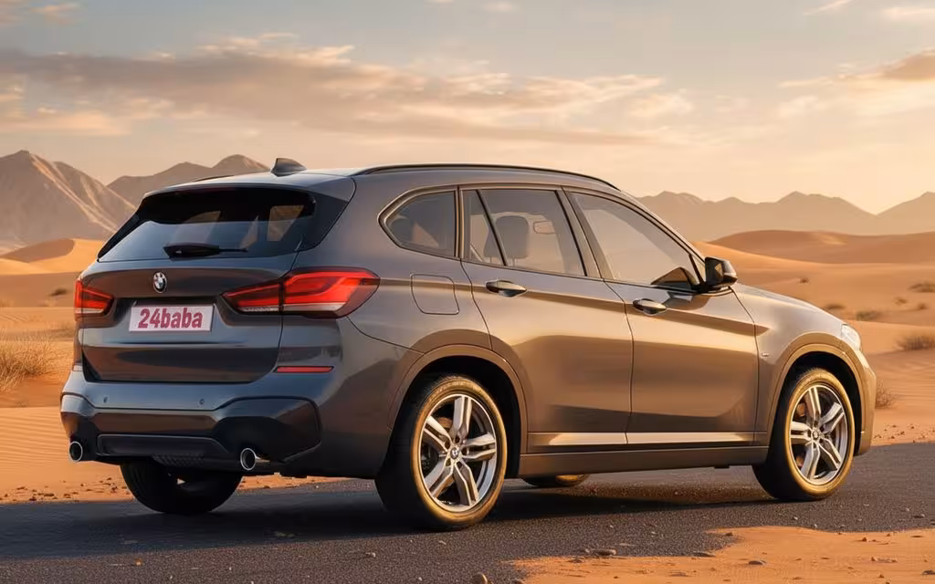 Bmw X1 2021 Blue rear view showing taillights – rental in Dubai