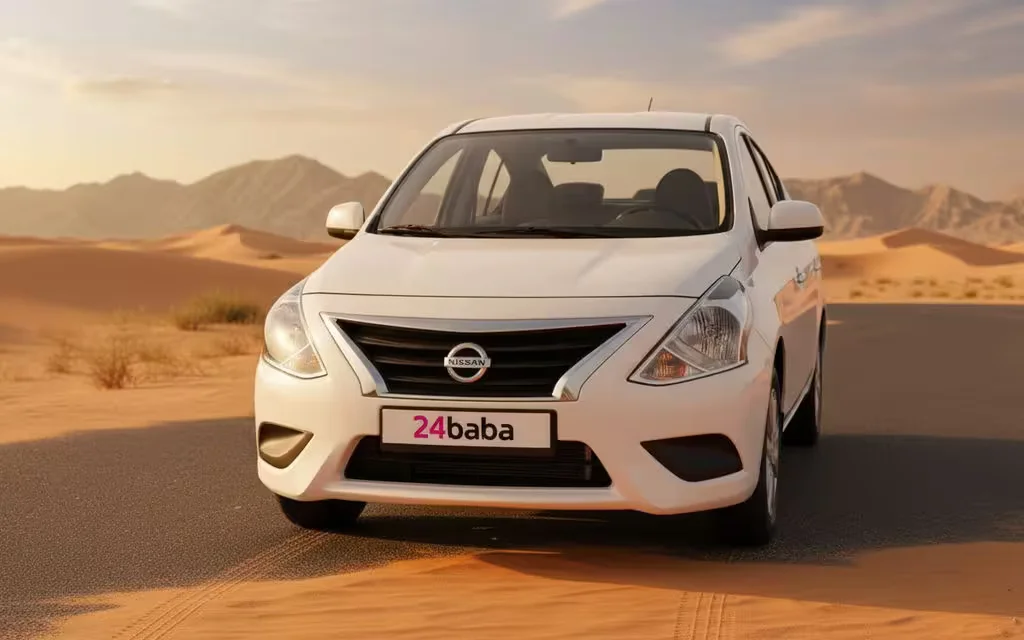 Nissan Sunny 2024 White front view with headlights – rental in Dubai