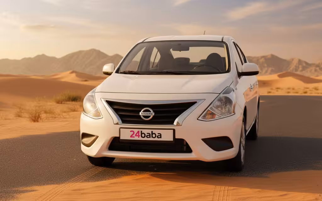 Nissan Sunny 2024 White front view with headlights – rental in Dubai