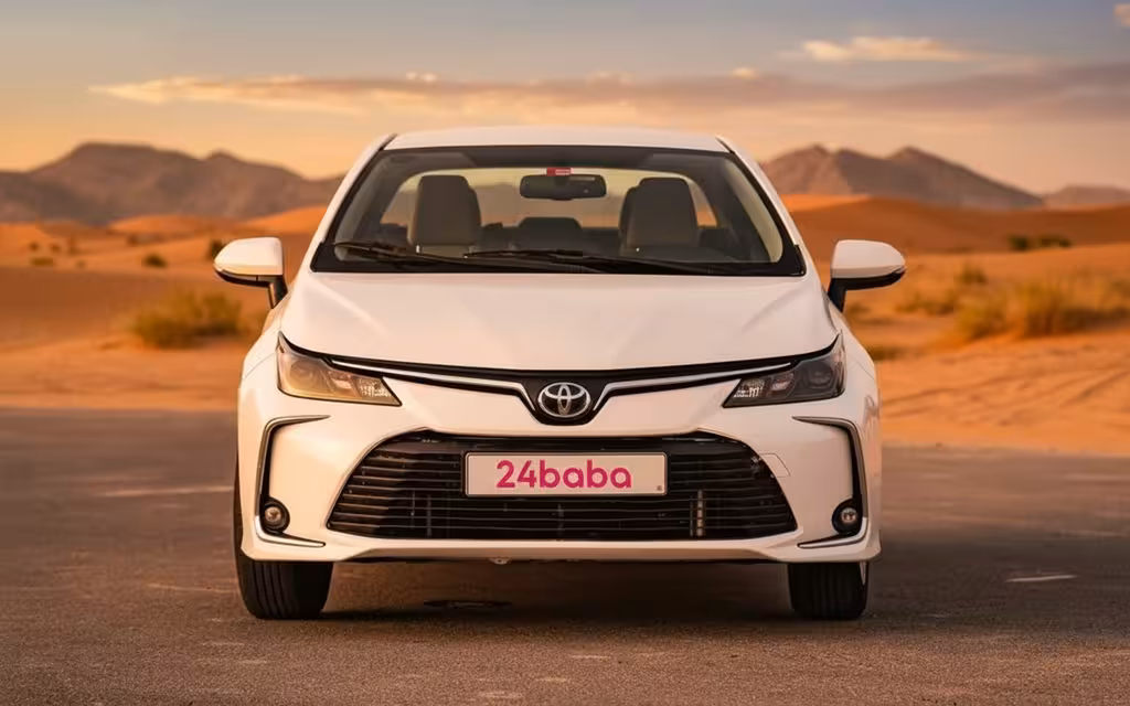 Toyota Corolla 2020 White front view with headlights – rental in Dubai