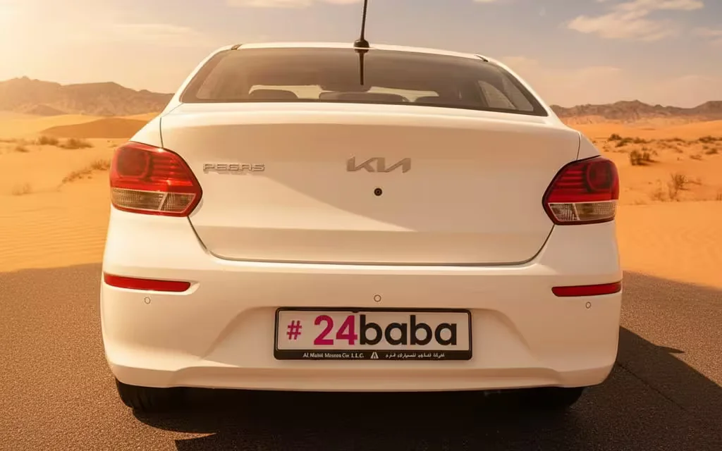 Kia Pegas 2025 White rear view showing taillights