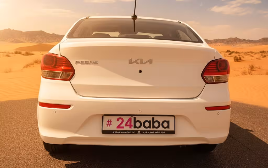 Kia Pegas 2025 White rear view showing taillights