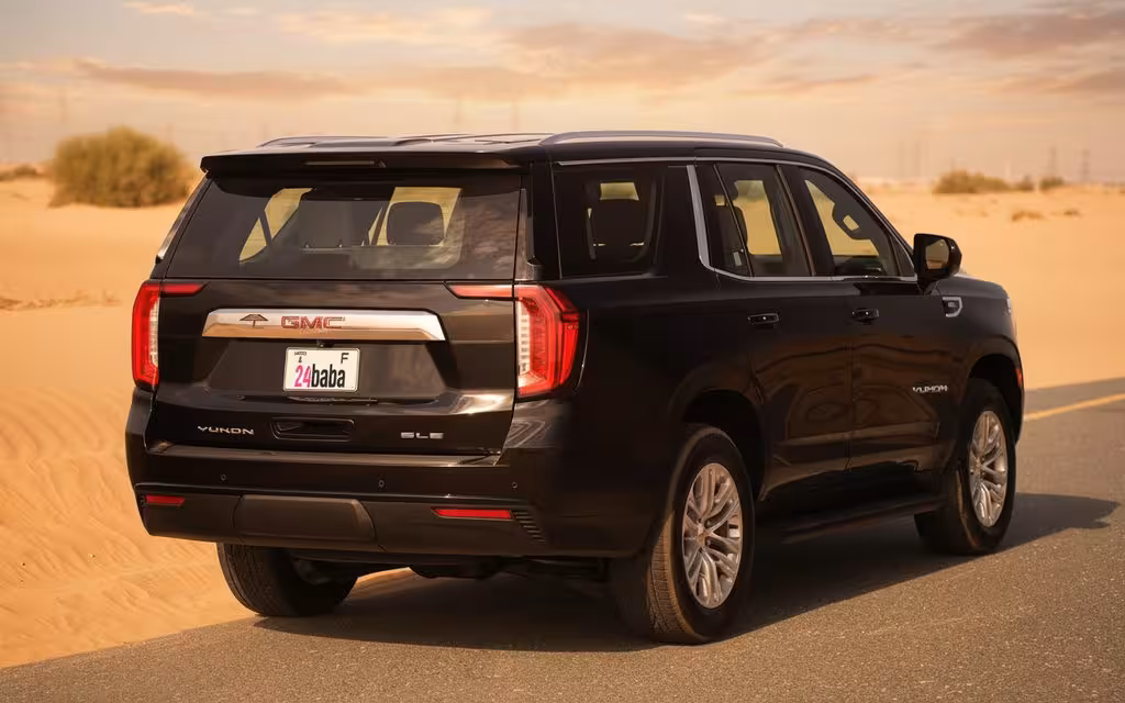 Gmc Yukon 2024 Black rear view showing taillights – rental in Dubai