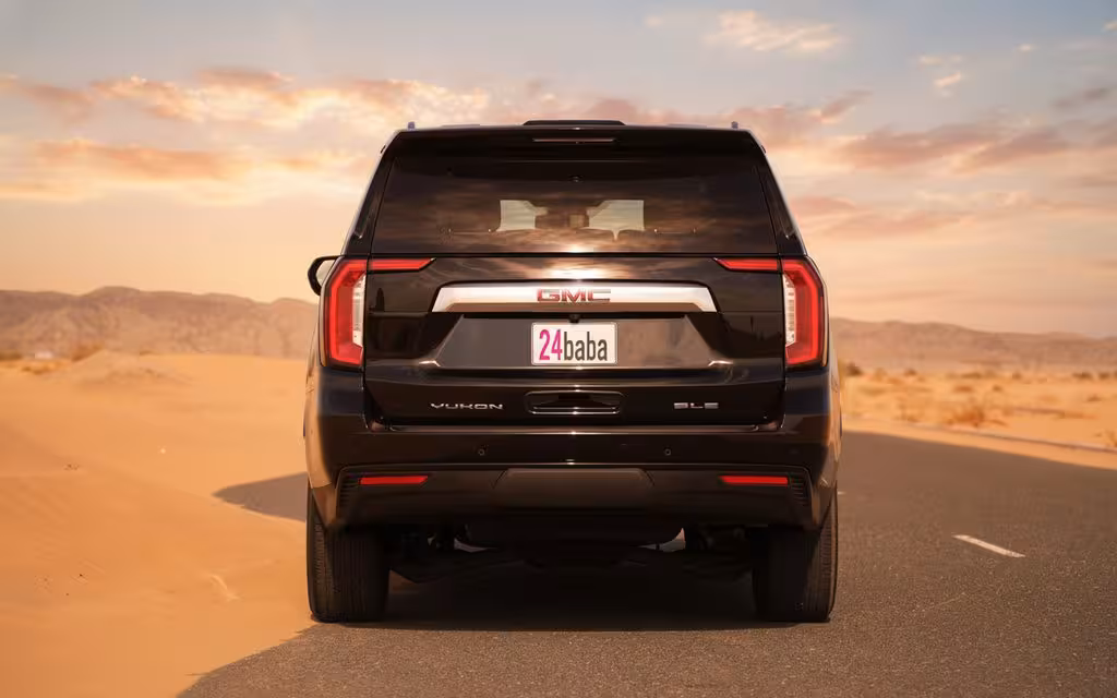 Gmc Yukon 2024 Black rear view showing taillights – rental in Dubai