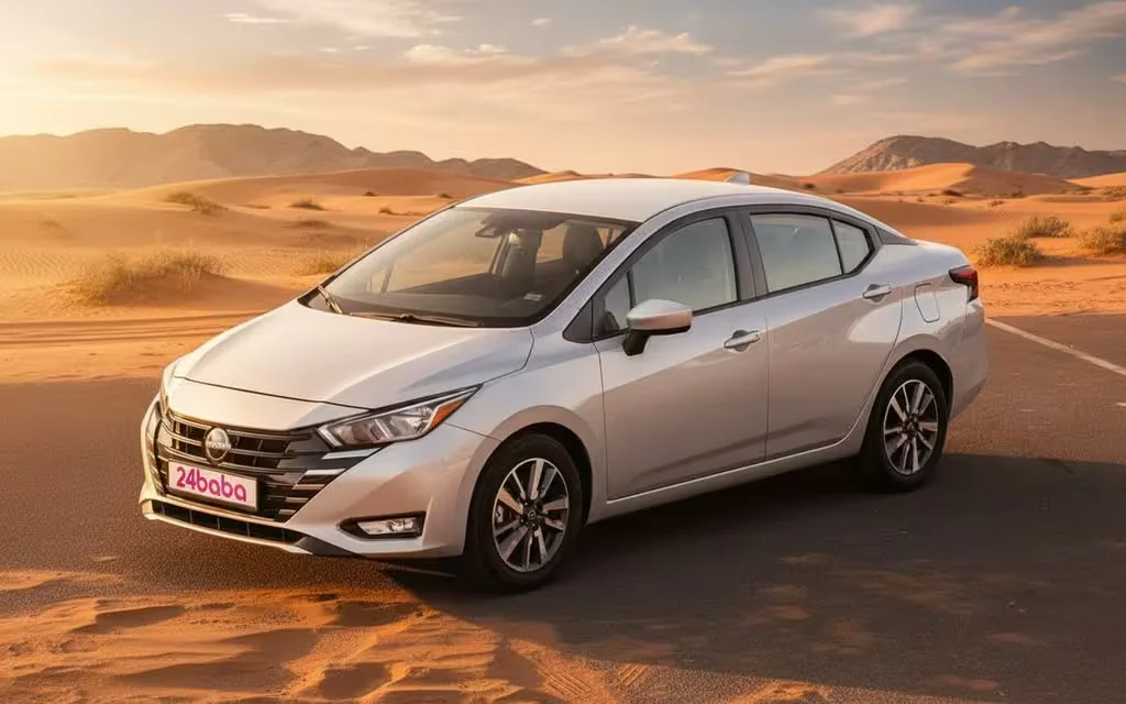 Nissan Versa 2024 Silver front view with headlights – rental in Dubai