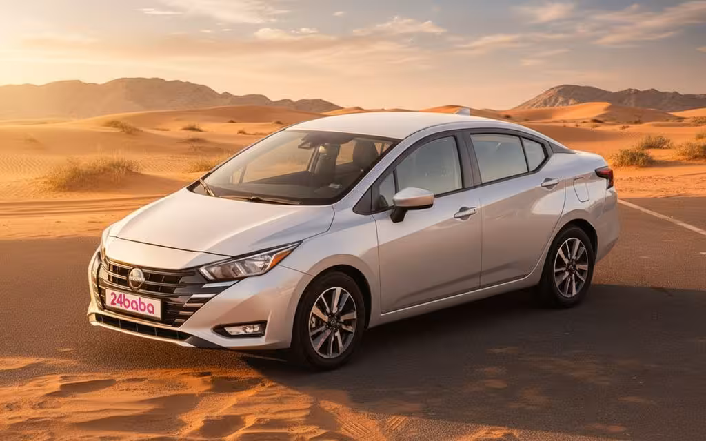 Nissan Versa 2024 Silver front view with headlights – rental in Dubai