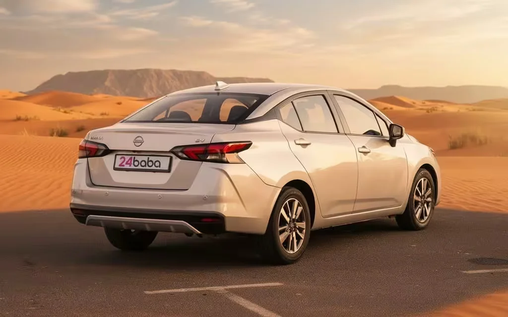 Nissan Versa 2024 Silver rear view showing taillights – rental in Dubai