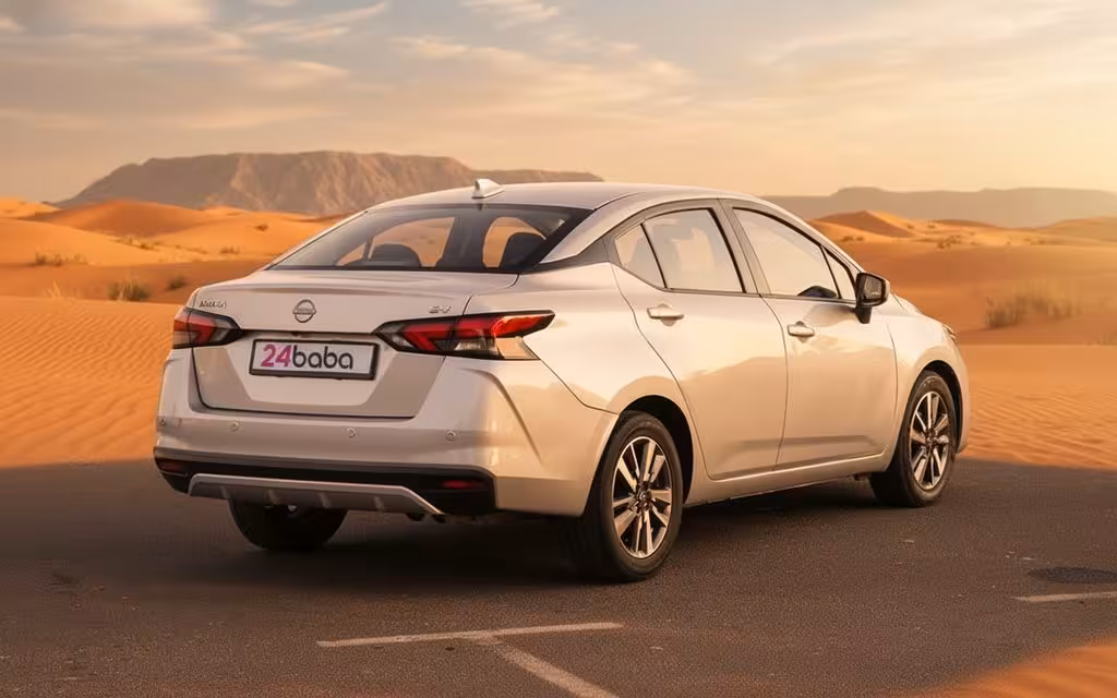 Nissan Versa 2024 Silver rear view showing taillights – rental in Dubai