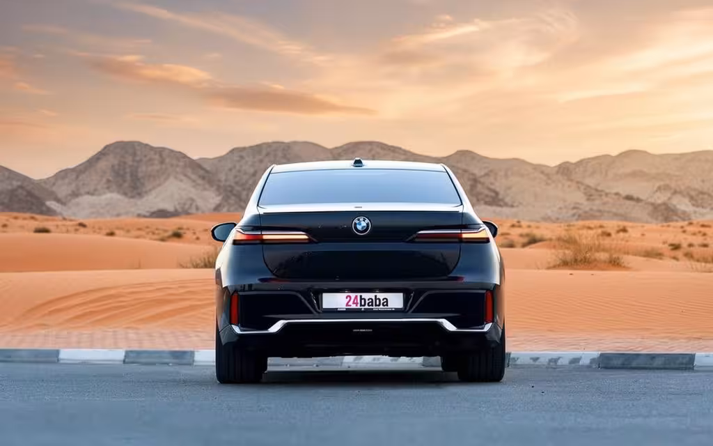 Bmw 735 2023 Black rear view showing taillights – rental in Dubai