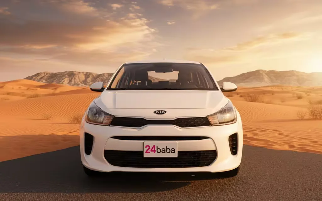 Kia Rio 2021 White front view with headlights – rental in Dubai