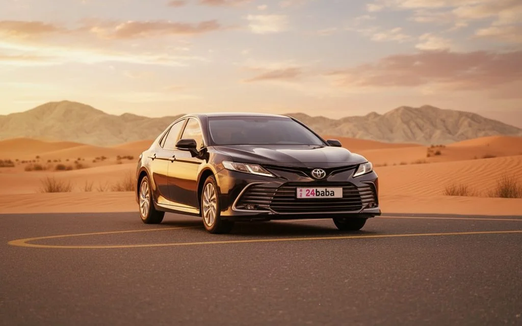 Toyota Camry 2023 Black front view with headlights – rental in Dubai