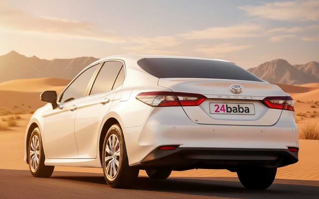 Toyota Camry 2023 White rear view showing taillights – rental in Dubai