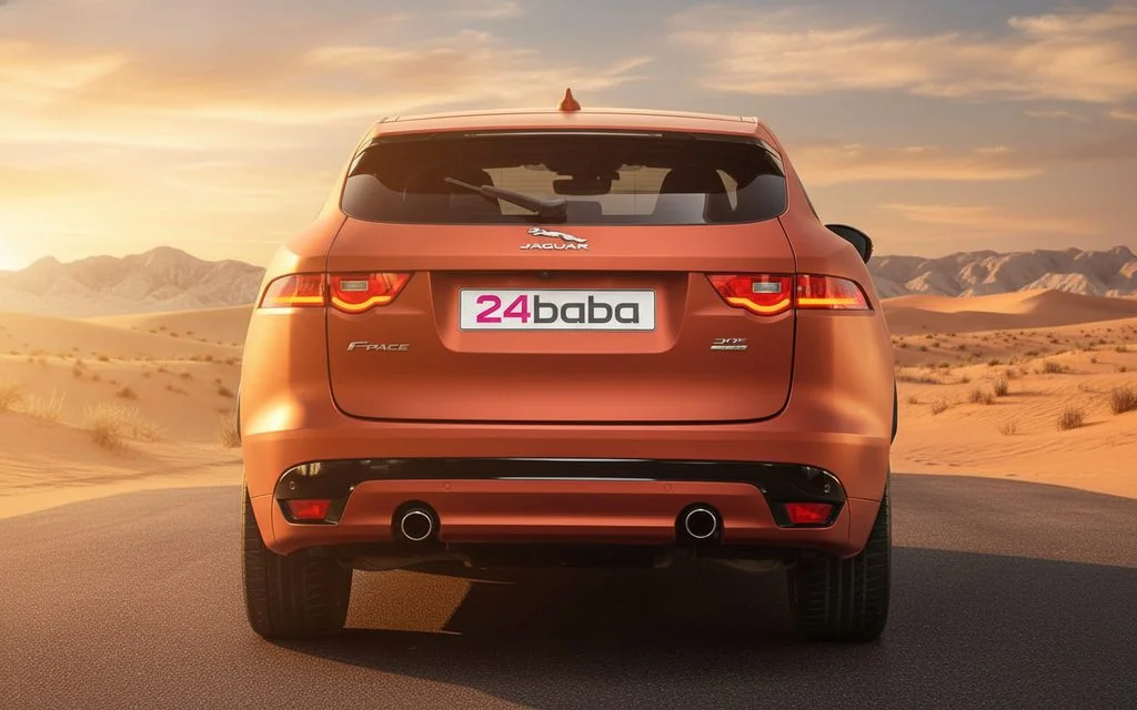 Jaguar E Pace 2020 Orange rear view showing taillights – rental in Dubai