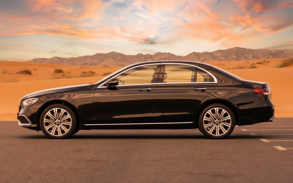 Mercedes E350 2023 Black side profile – rental in Dubai