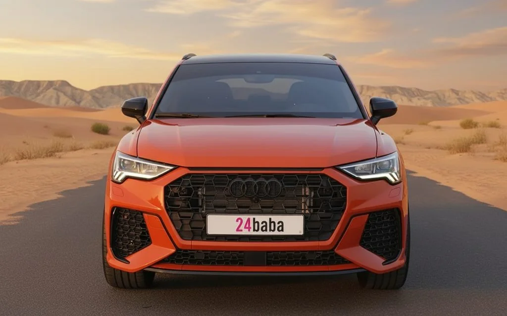 Audi Q3 2022 Orange front view with headlights – rental in Dubai
