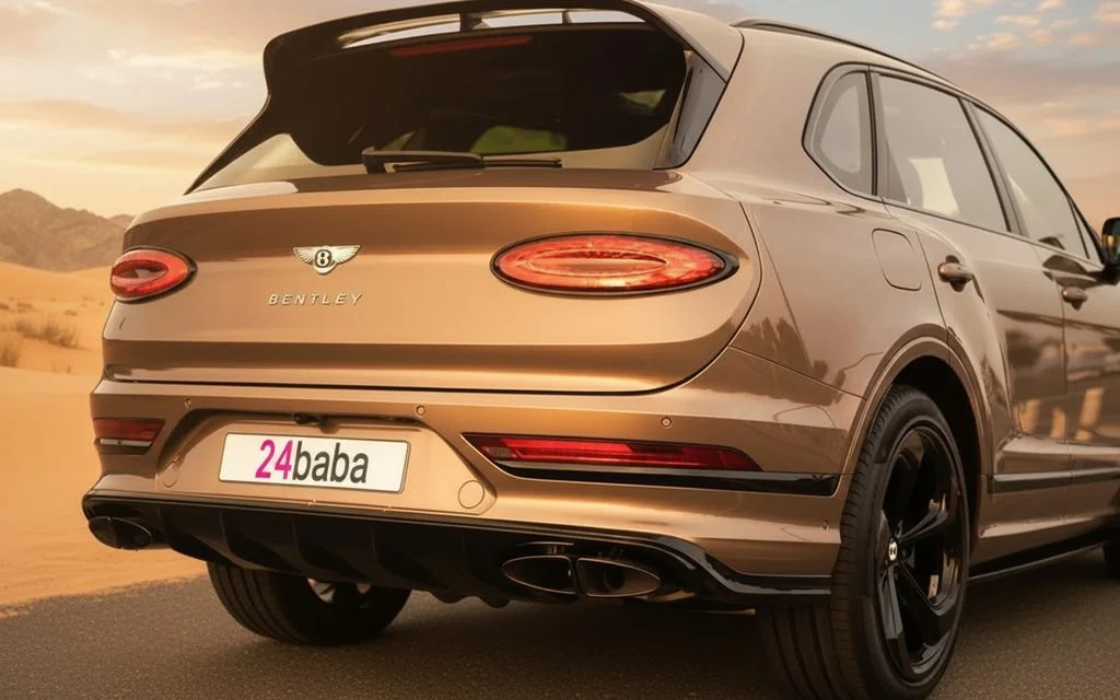 Bentley Bentayga 2022 Gold rear view showing taillights – rental in Dubai